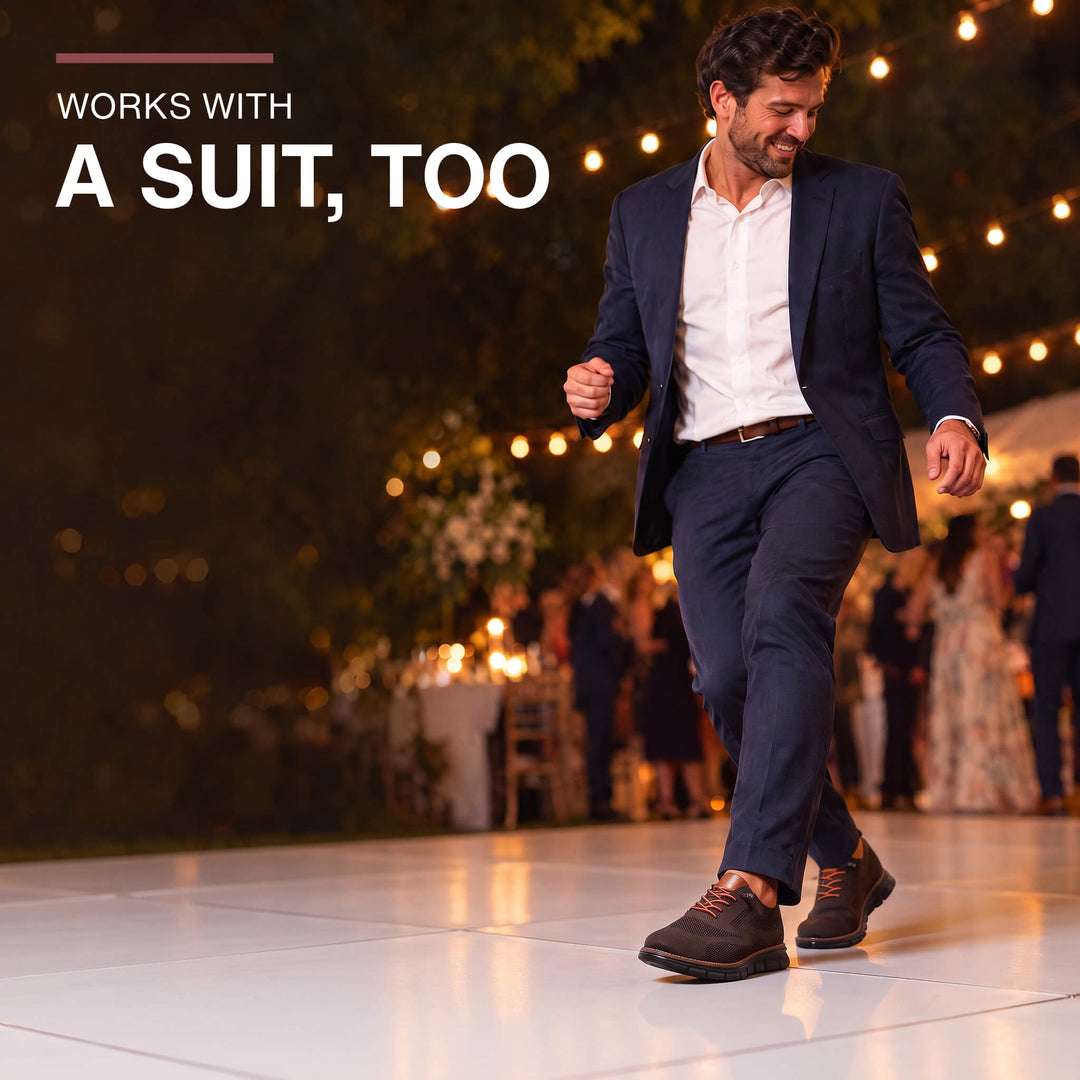 Brown Midnight Breeze sneakers worn with a navy suit at a wedding