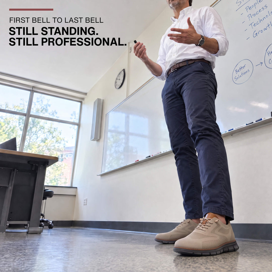 Teacher in navy chinos wearing khaki Midnight Breeze sneakers in a classroom