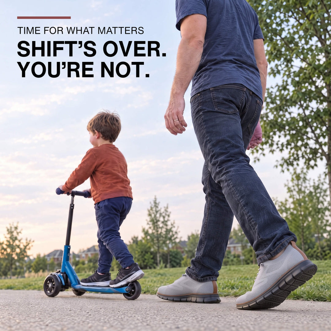 Man playing with his son after work, wearing gray Midnight Breeze sneakers